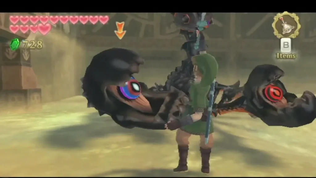 Two armored Moldarach claws rise from the sand, each with a blue and red eye, and Link stands between them Two armored Moldarach claws rise from the sand, each with a blue and red eye, and Link stands between them