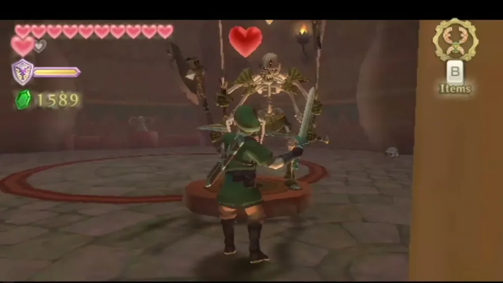 A heart drops above the Stalmaster as Link stands on a raised platform in the Ancient Cistern arena A heart drops above the Stalmaster as Link stands on a raised platform in the Ancient Cistern arena