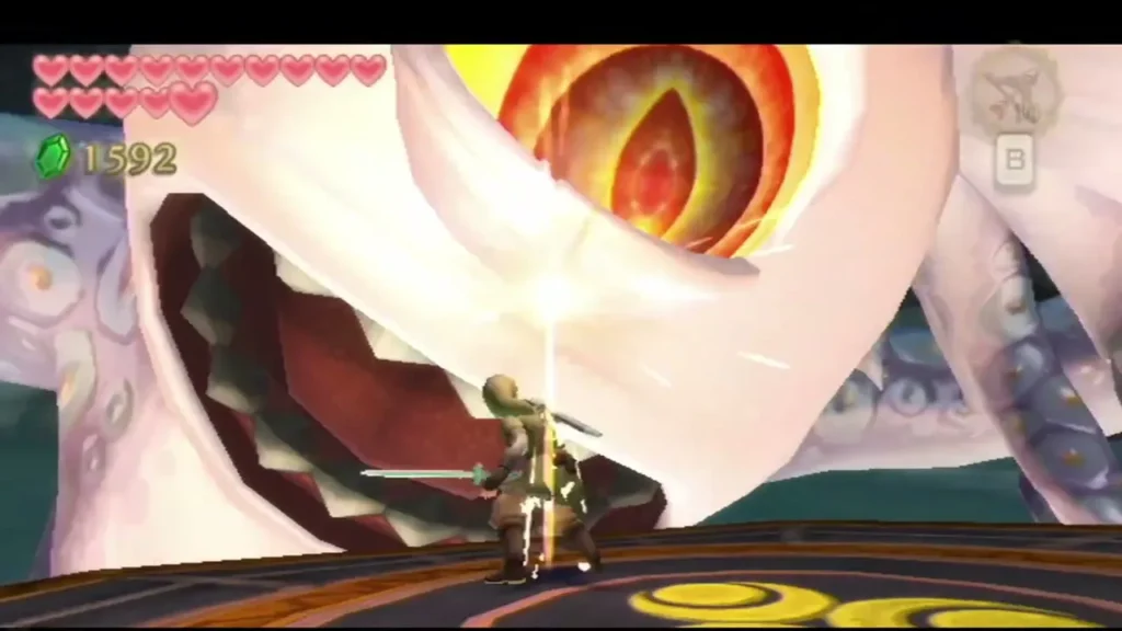 Link's sword strikes the glowing eye of Tentalus as its open jaws loom over the Sandship deck Link's sword strikes the glowing eye of Tentalus as its open jaws loom over the Sandship deck