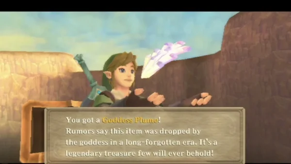Link holds up a Goddess Plume in a sandstone desert canyon, with the full pickup message. Link holds up a Goddess Plume in a sandstone desert canyon, with the full pickup message.