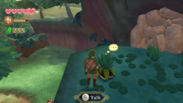 A Kikwi peeks out from under a leafy bud in Faron Woods while Link stands nearby. A Kikwi peeks out from under a leafy bud in Faron Woods while Link stands nearby.