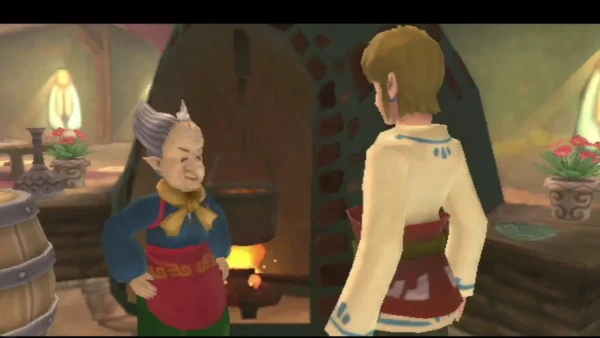 A grey-haired cook in a blue top and red apron stands beside Link at a kitchen hearth. A grey-haired cook in a blue top and red apron stands beside Link at a kitchen hearth.