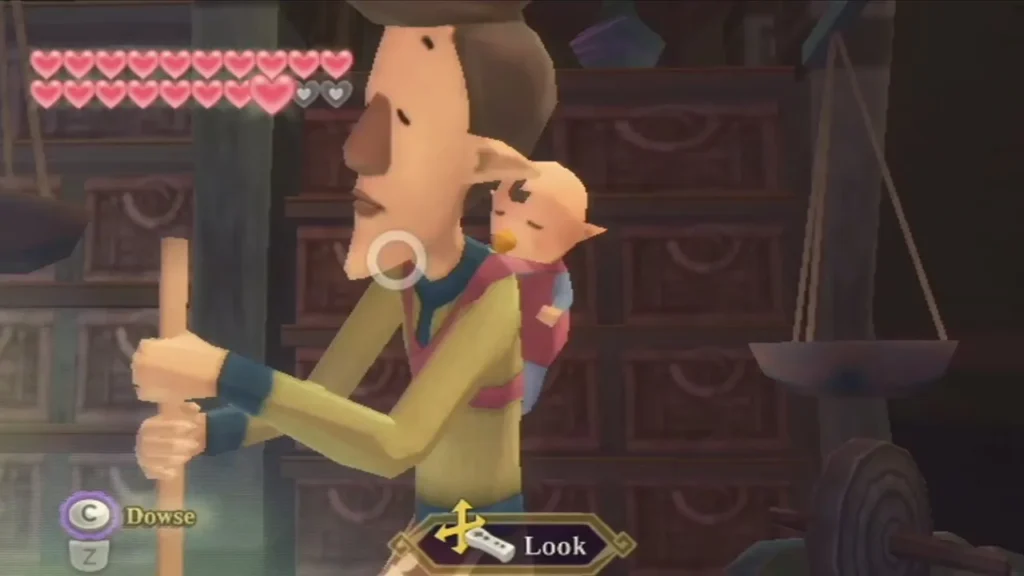 A man in the potion shop stands with a baby asleep on his back. A man in the potion shop stands with a baby asleep on his back.