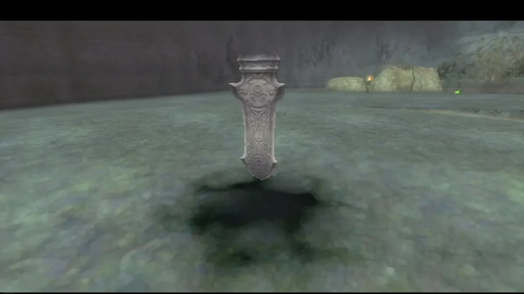 A silver sealing spike stands over a dark pit in the grey ground of the Sealed Grounds. A silver sealing spike stands over a dark pit in the grey ground of the Sealed Grounds.