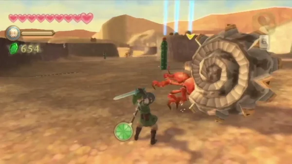 Link readies his sword beside an Ampilus, a red crab with a large spiral shell, on the desert sand. Link readies his sword beside an Ampilus, a red crab with a large spiral shell, on the desert sand.