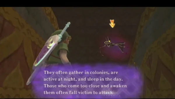 A dark bat-like Keese hovers in a temple hall while a text box says they gather in colonies and are active at night. A dark bat-like Keese hovers in a temple hall while a text box says they gather in colonies and are active at night.