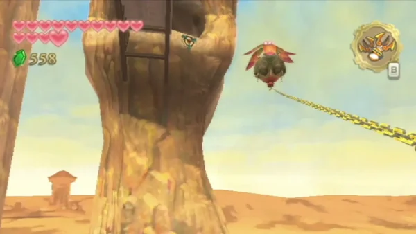 Link's Clawshot chain hooks a red-winged flying creature near a pale desert rock pillar. Link's Clawshot chain hooks a red-winged flying creature near a pale desert rock pillar.