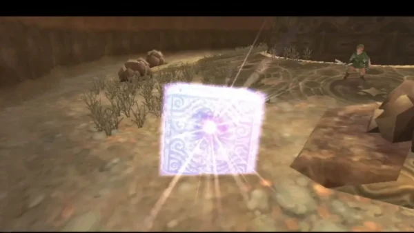 A Goddess Cube bursts with light on the sand beside the circular patterned platform in Lanayru Desert