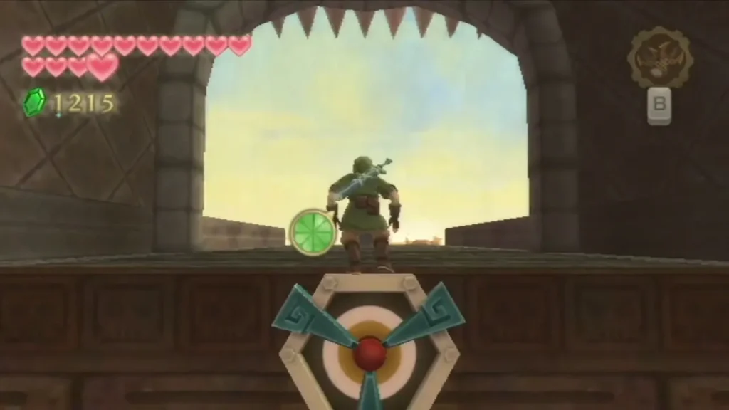 A hexagonal Clawshot target sits on the wall below Link as he stands in the stone doorway of the Pirate Stronghold A hexagonal Clawshot target sits on the wall below Link as he stands in the stone doorway of the Pirate Stronghold