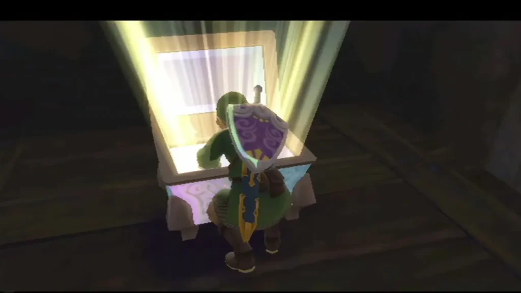 Link kneels at a Goddess Chest in a dim room, its light beam rising from the open lid. Link kneels at a Goddess Chest in a dim room, its light beam rising from the open lid.