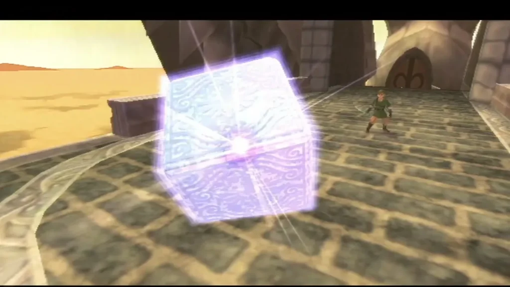 A glowing Goddess Cube beside the sandy stone bridge outside the Pirate Stronghold in the Sand Sea A glowing Goddess Cube beside the sandy stone bridge outside the Pirate Stronghold in the Sand Sea