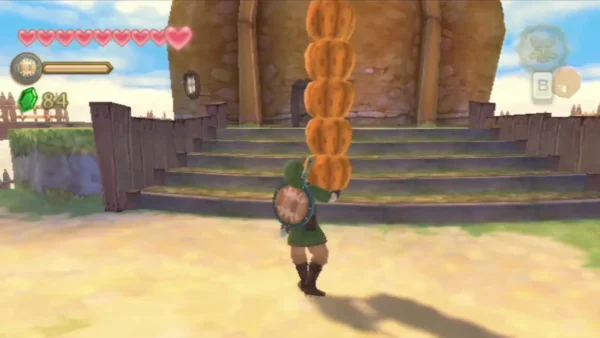 Link carries a tall stack of pumpkins up stone steps in Skyloft, keeping the pile balanced. Link carries a tall stack of pumpkins up stone steps in Skyloft, keeping the pile balanced.