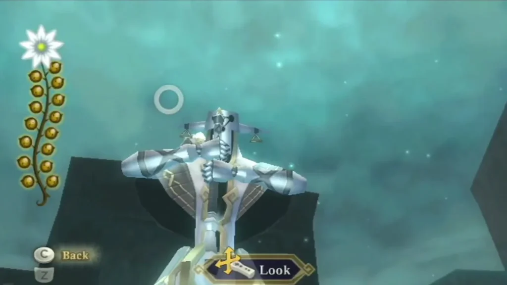 Link looks up at a silver and gold Guardian against the icy sky, with the Look prompt on screen.
