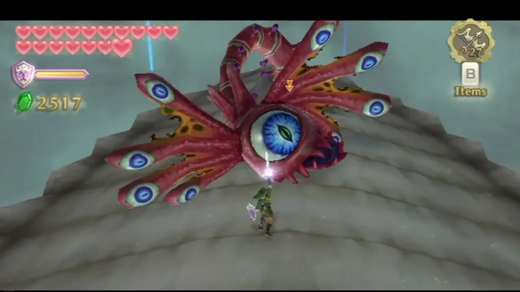 The blue eye of the red parasite Bilocyte sits among its tentacles while Link stands on the rock below. The blue eye of the red parasite Bilocyte sits among its tentacles while Link stands on the rock below.