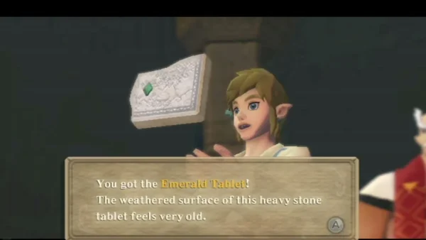 Link holds up the Emerald Tablet, and the box says the weathered stone tablet feels very old. Link holds up the Emerald Tablet, and the box says the weathered stone tablet feels very old.
