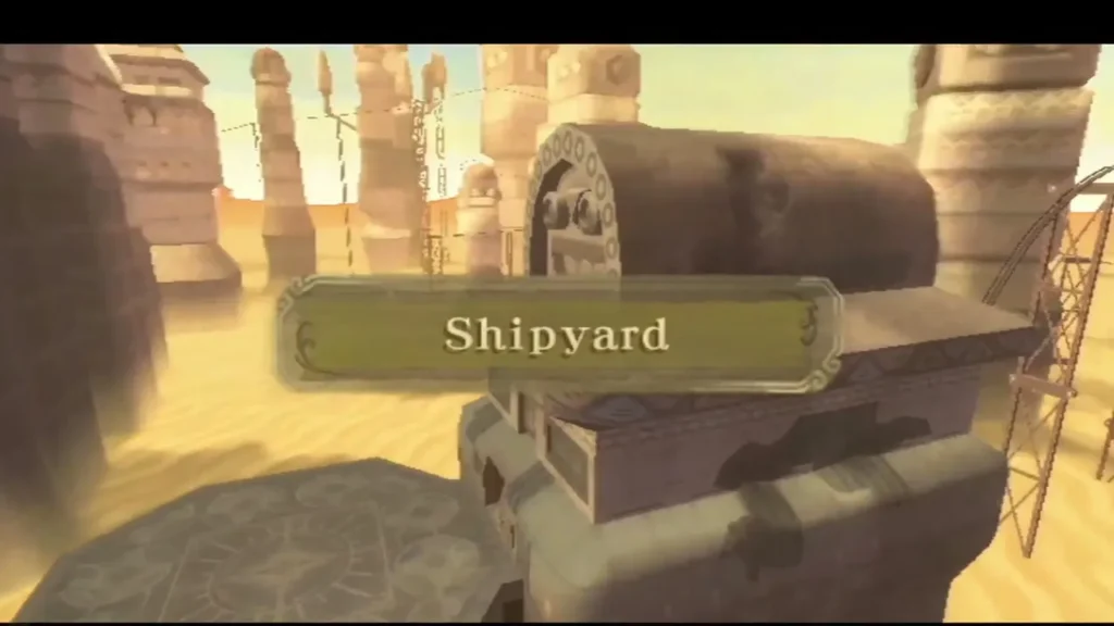 The Shipyard title banner appears over ruined sandstone buildings and a large machine housing in the sand. The Shipyard title banner appears over ruined sandstone buildings and a large machine housing in the sand.