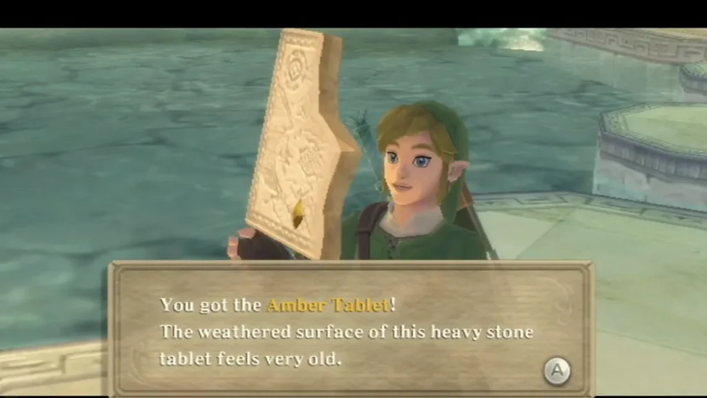 Link holds up the Amber Tablet, with its item box across the bottom of the screen