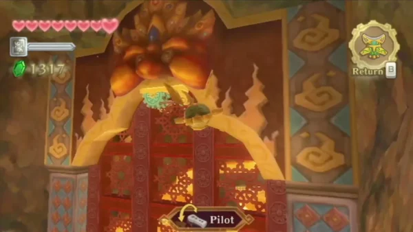A Beetle flies under the gear and rope at the top of the large red gate.