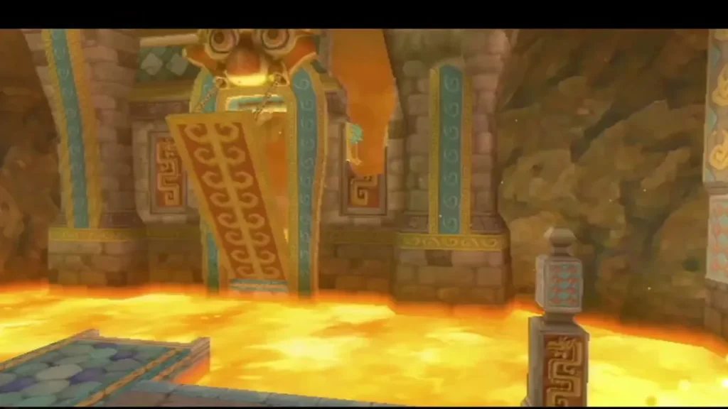 A red and gold drawbridge stands raised above the lava in the Earth Temple, held up by chains.