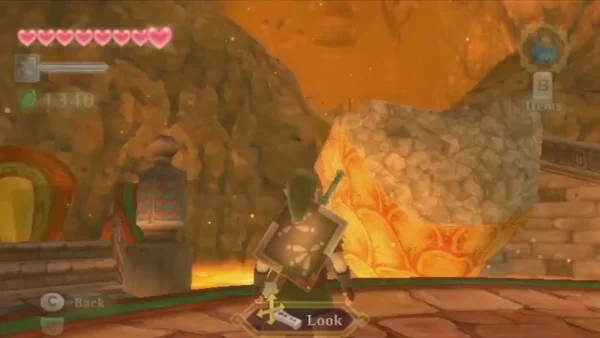 Link beside a large stone boulder on the lava-edged path up the Earth Temple slope