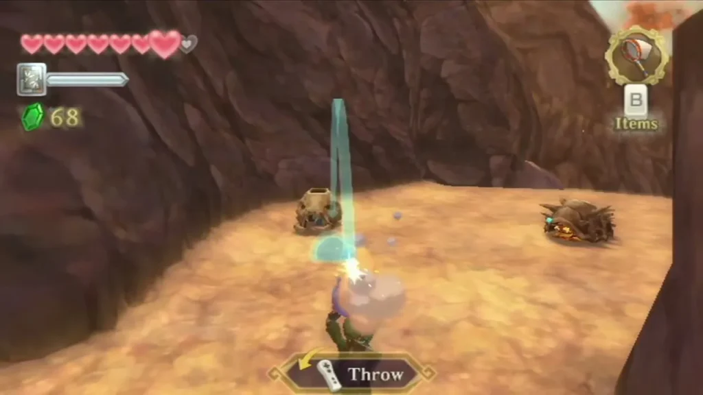 Link readies a bomb flower to throw at a Pyrup shell and a spiky lava creature in a rocky cave Link readies a bomb flower to throw at a Pyrup shell and a spiky lava creature in a rocky cave