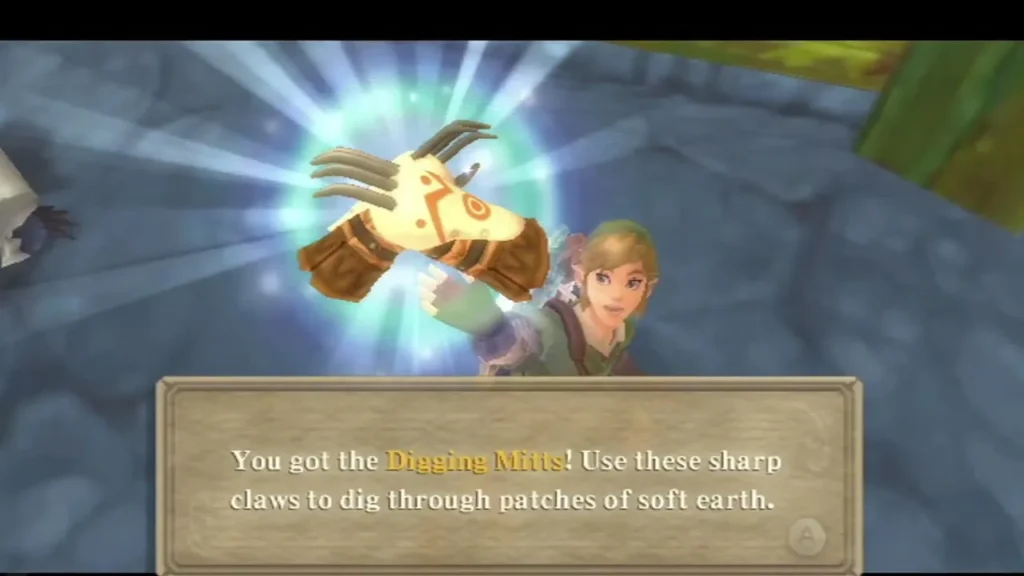 Link holds up the Digging Mitts, glowing, with the message box describing digging through soft earth Link holds up the Digging Mitts, glowing, with the message box describing digging through soft earth
