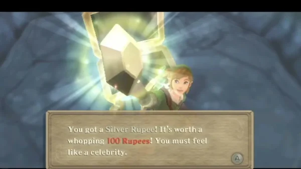 Link holds up a Silver Rupee, and the box says it is worth a whopping 100 Rupees. Link holds up a Silver Rupee, and the box says it is worth a whopping 100 Rupees.