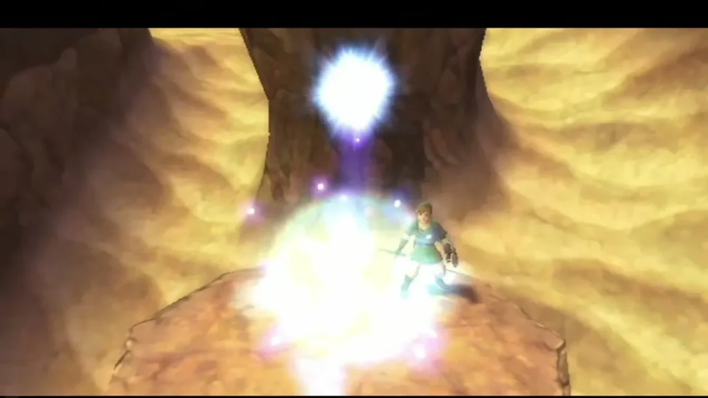 A bright orb of light rises from the struck cube above Link on the sandy ledge in Eldin Volcano A bright orb of light rises from the struck cube above Link on the sandy ledge in Eldin Volcano