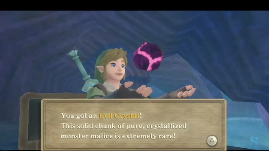 Link holds up the Evil Crystal, and its box says the crystallized monster malice is extremely rare.