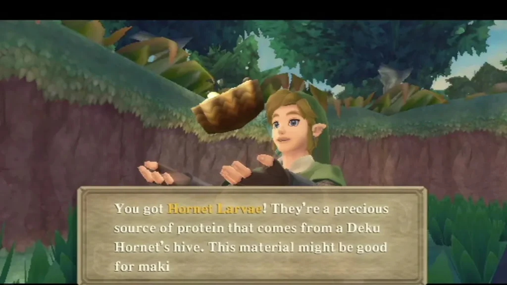 Link holds up Hornet Larvae, and its box explains they come from a Deku Hornet's hive and may help make maki. Link holds up Hornet Larvae, and its box explains they come from a Deku Hornet's hive and may help make maki.
