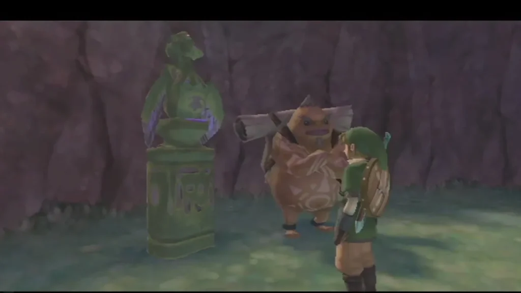 Link walks up to a green bird statue beside Gorko in the rocky clearing. Link walks up to a green bird statue beside Gorko in the rocky clearing.