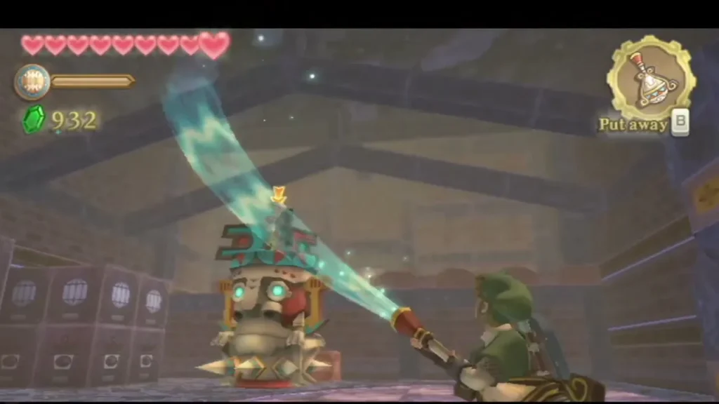 Link aims the Gust Bellows at a stone Armos with cyan eyes in the Facility. Link aims the Gust Bellows at a stone Armos with cyan eyes in the Facility.