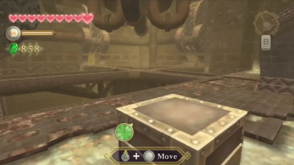 A steel box sits on a stone floor under overhead pipes, with the Move prompt on screen. A steel box sits on a stone floor under overhead pipes, with the Move prompt on screen.