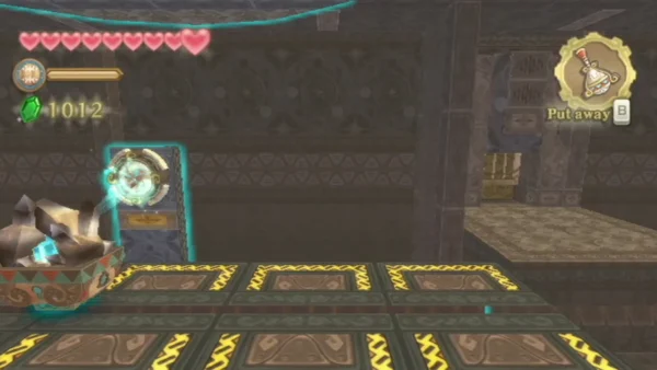A crystal-topped cart sits beside a round wall device on the yellow zig-zag floor. A crystal-topped cart sits beside a round wall device on the yellow zig-zag floor.