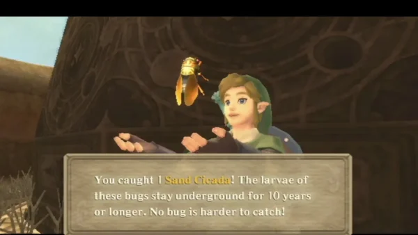 Link holds up a Sand Cicada he has caught, with its full text box explaining how hard the bugs are to catch. Link holds up a Sand Cicada he has caught, with its full text box explaining how hard the bugs are to catch.