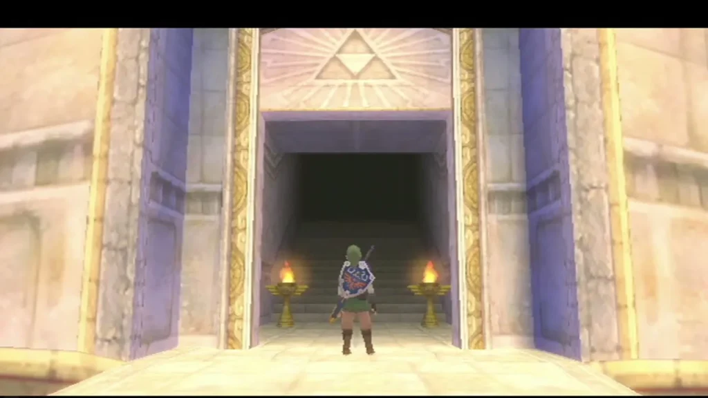 Link stands before the Sky Keep entrance with its Triforce mark above the torch-lit stairs