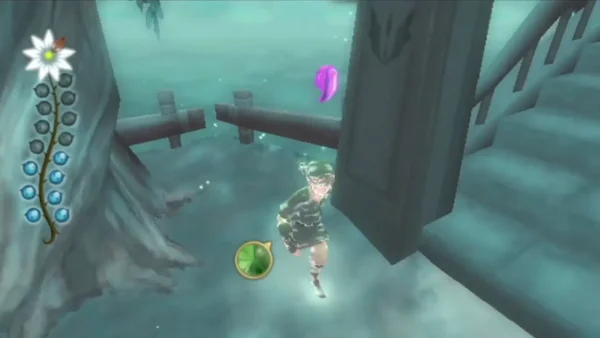 Link runs up a stone stair past a tall pillar, a glowing pink drop floating in the air above him.