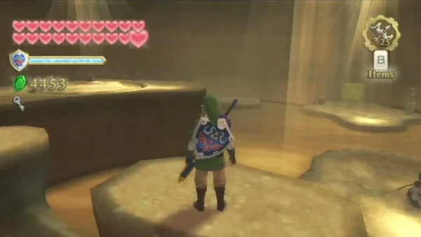 Link stands on a sand platform above the sinksand, with a bird-like statue on a ledge at the right edge.