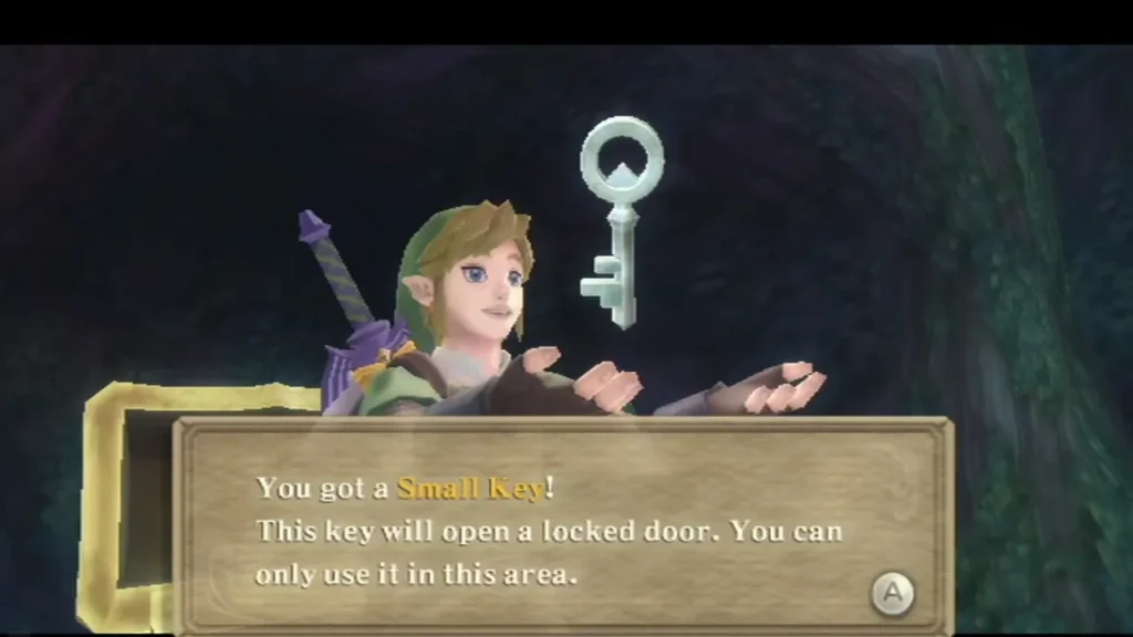 Link holds up a Small Key, its message box reading that it opens a locked door and works only in this area