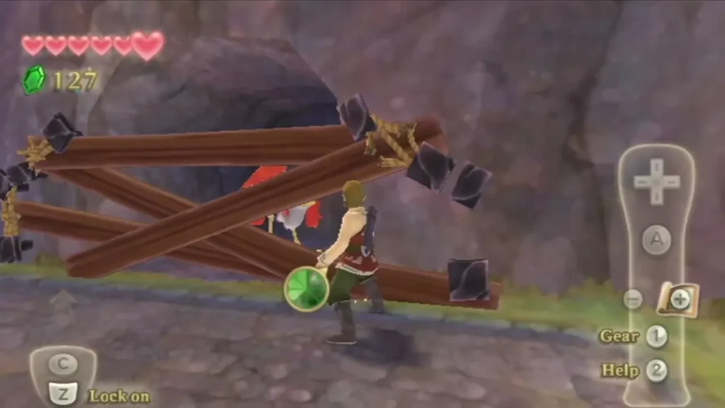 Link stands beside a barricade of logs and ropes against the rock wall, with a red bird trapped behind it. Link stands beside a barricade of logs and ropes against the rock wall, with a red bird trapped behind it.