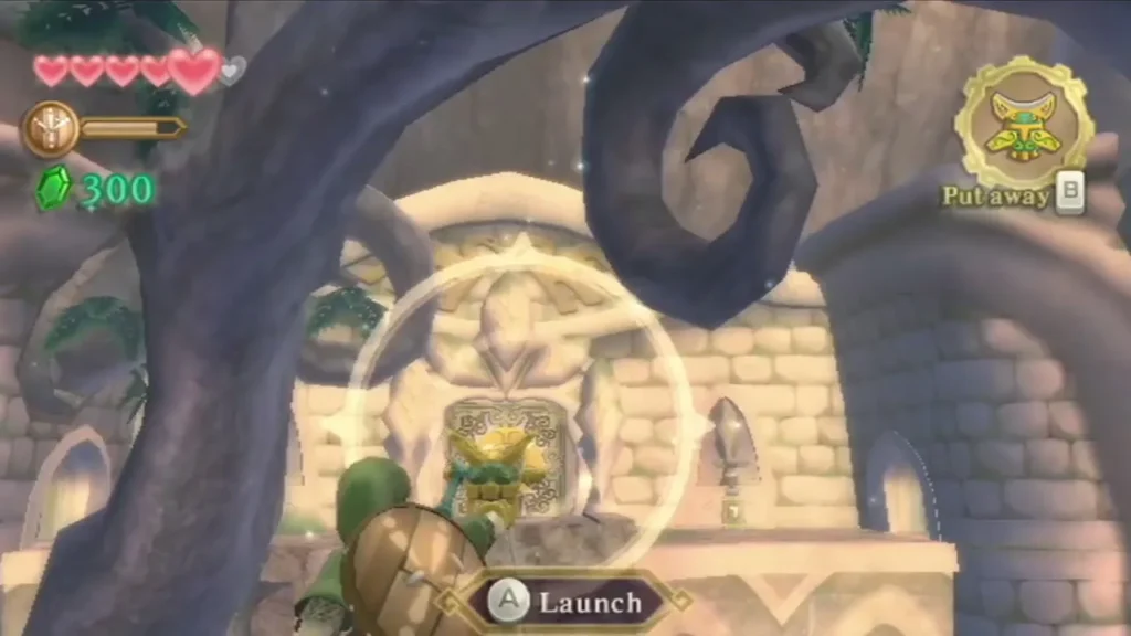 Link readies the Beetle to launch at the gold crystal switch in the carved wall, with the Launch prompt showing. Link readies the Beetle to launch at the gold crystal switch in the carved wall, with the Launch prompt showing.