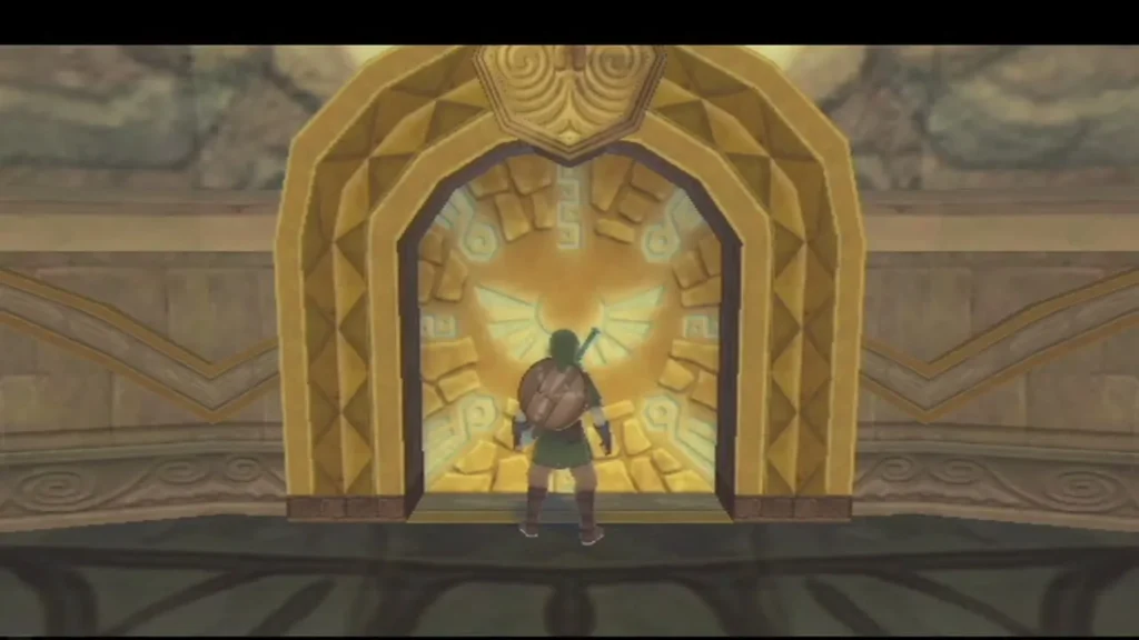 Link stands before the glowing golden doorway at the back of the temple hall, with the Skyward crest above it. Link stands before the glowing golden doorway at the back of the temple hall, with the Skyward crest above it.