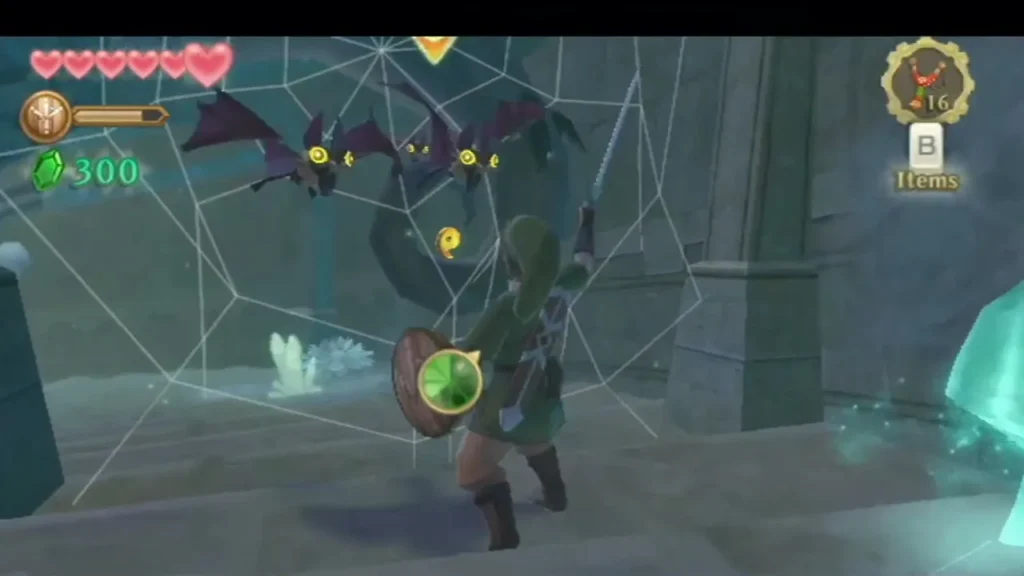 A Keese swoops over Link as he moves through spider webs in the temple hall. A Keese swoops over Link as he moves through spider webs in the temple hall.