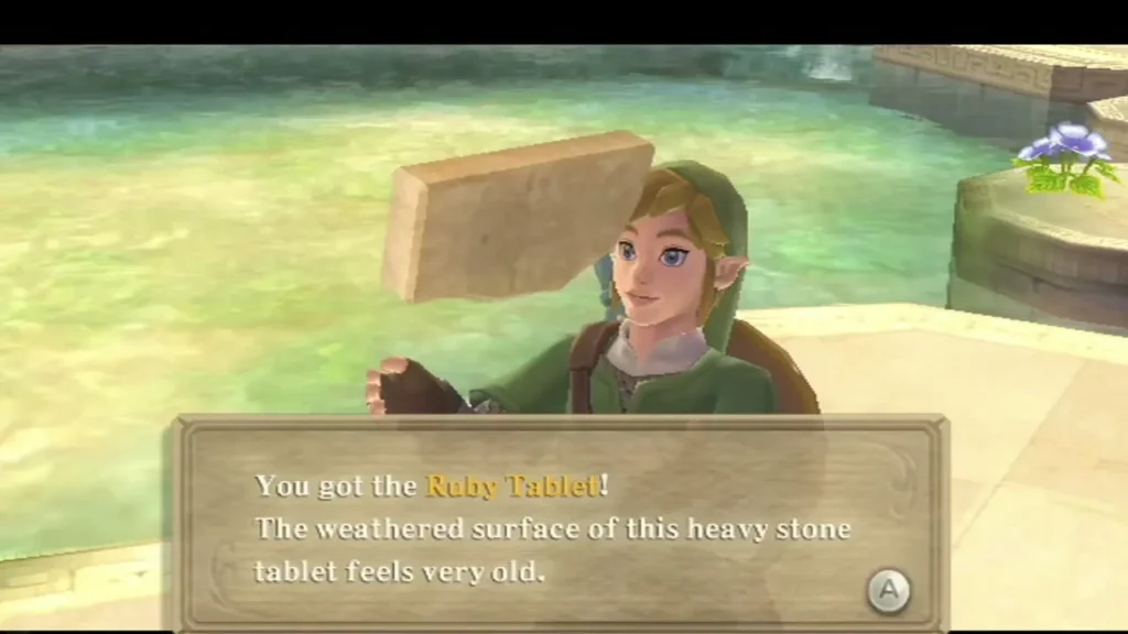 Link holds up the Ruby Tablet, with a box describing its weathered, very old stone. Link holds up the Ruby Tablet, with a box describing its weathered, very old stone.