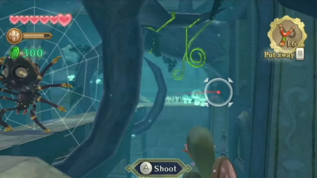 Link aims the Slingshot at two curled green vines hanging above a gap, with a Skulltula on its web nearby. Link aims the Slingshot at two curled green vines hanging above a gap, with a Skulltula on its web nearby.