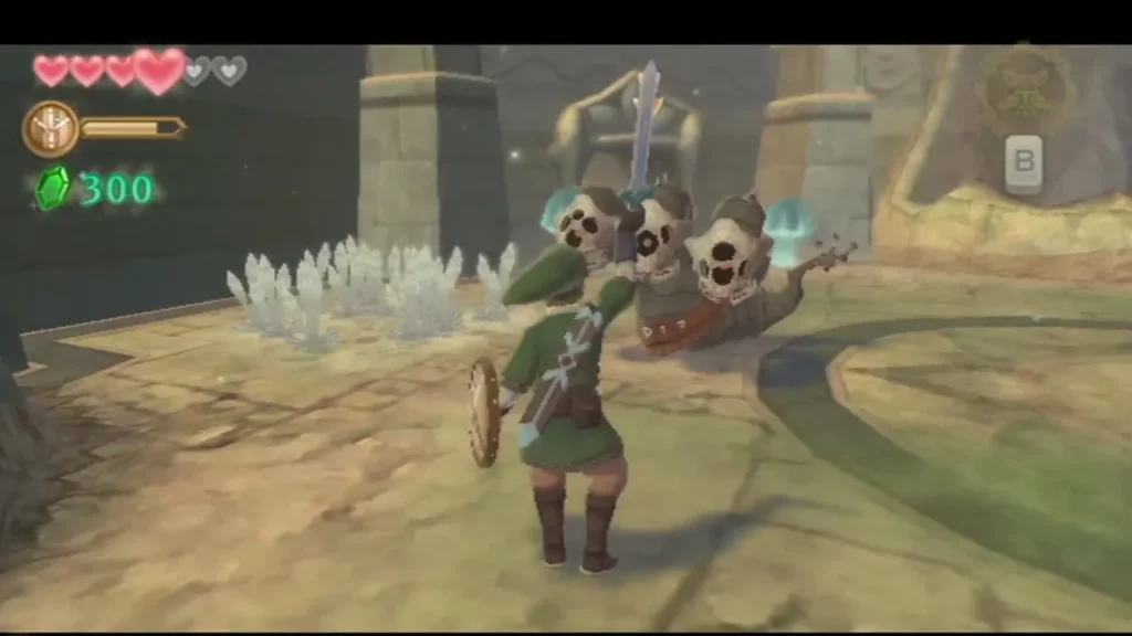 Link slashes at the three Staldra heads, which line up together in the sand arena. Link slashes at the three Staldra heads, which line up together in the sand arena.