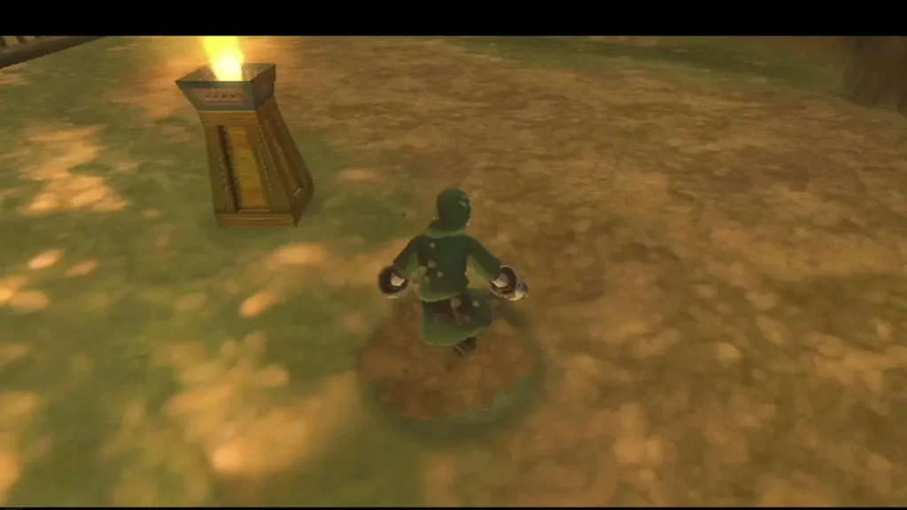 Link stands on a dirt patch in the Eldin cell area, wearing the Mogma Mitts, with a lit brazier nearby.