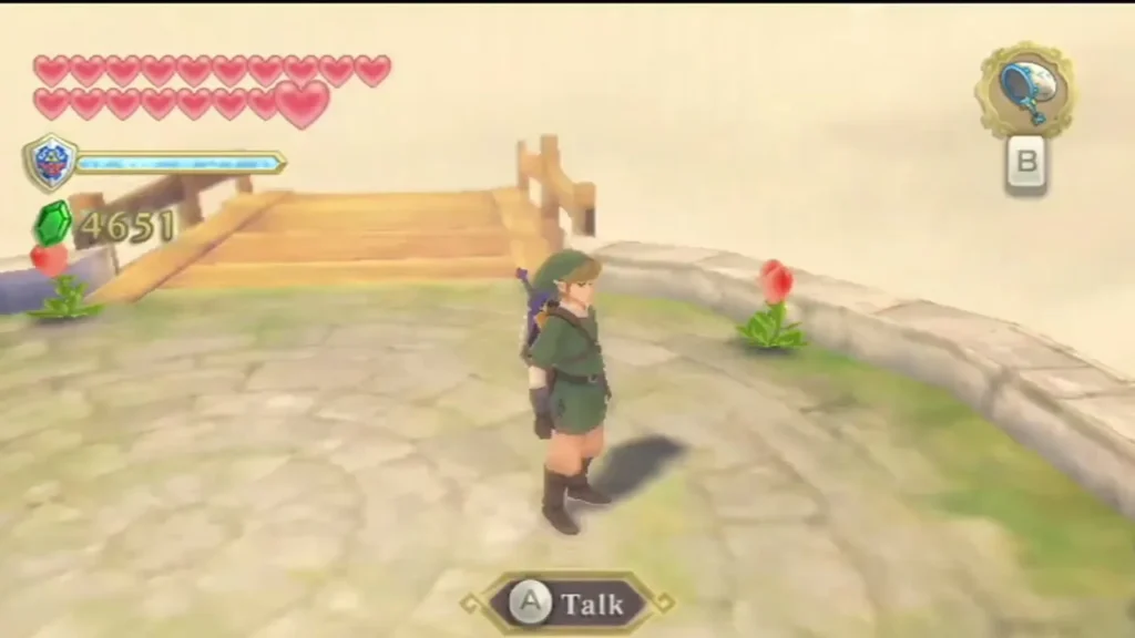 Link stands alone on a round stone island in the Thunderhead, with a Talk prompt at the bottom of the screen. Link stands alone on a round stone island in the Thunderhead, with a Talk prompt at the bottom of the screen.