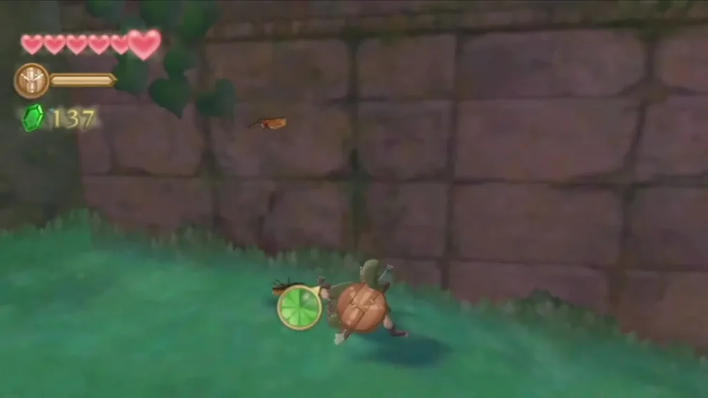 Link chases a Woodland Rhino Beetle with his Bug Net across the grass beside a mossy stone wall. Link chases a Woodland Rhino Beetle with his Bug Net across the grass beside a mossy stone wall.