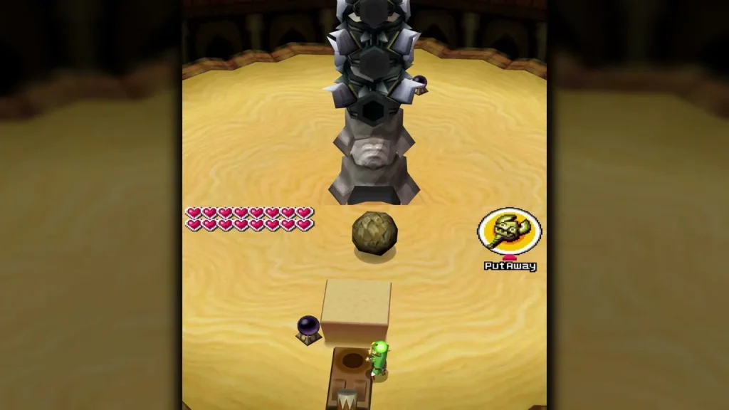 A boulder rolling across the sand toward Skeldritch's segmented body in the Sand Temple arena A boulder rolling across the sand toward Skeldritch's segmented body in the Sand Temple arena